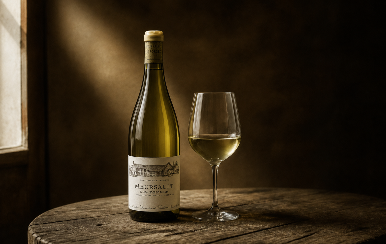 A bottle of Meursault and a filled glass resting on a barrel head, lit by a single shaft of cellar light